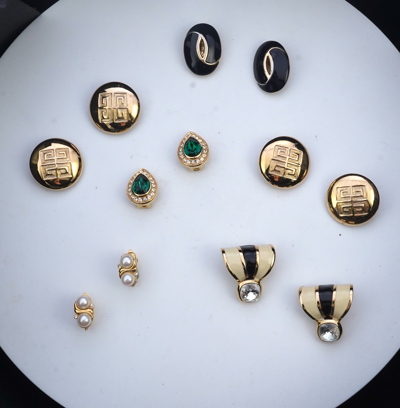 Two pairs of Givenchy clip earrings and four other pairs.